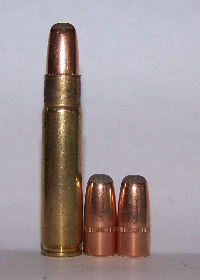 The cartridge at left illustrates the proper overall length for the .35 Remington just before crimping.